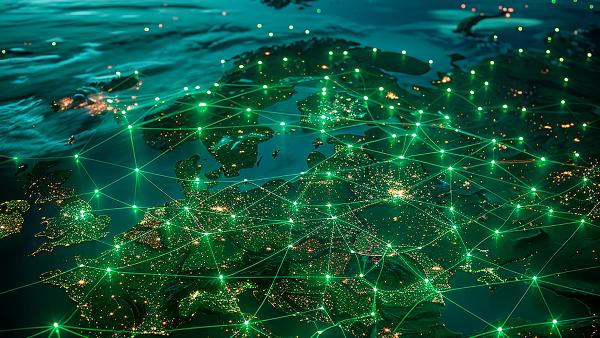 Night view of Europe from space, with glowing green lines connecting cities across the continent