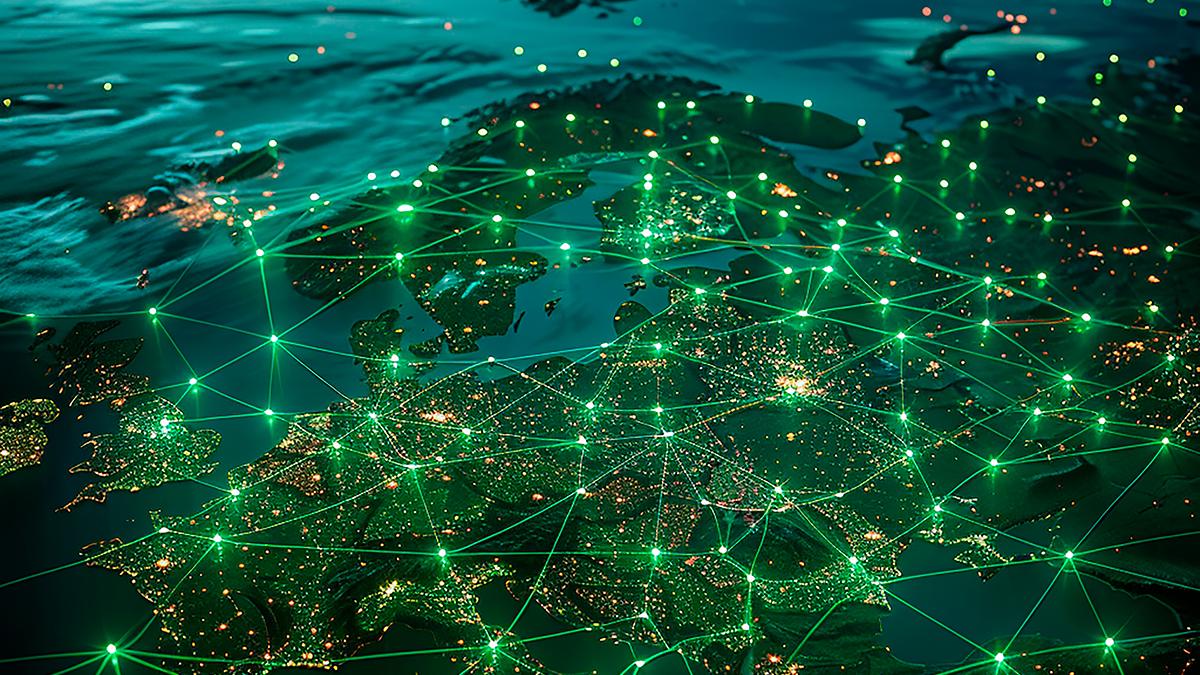 Night view of Europe from space, with glowing green lines connecting cities across the continent